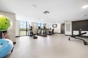 Deerfield Beach apartment for rent - A gym with a variety of equipment including a treadmill, a stationary bike, and a rowing machine.