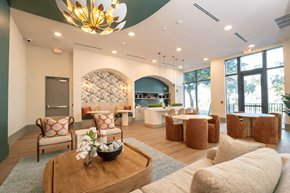 Miami apartment for rent - A large room with a Christmas tree and a chandelier.