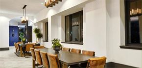 New Rochelle apartment for rent - a dining room with a long table and chairs  at Shearwood Station, New York