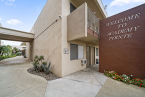 North Hollywood apartment for rent - The front of the Academy Pointe building is shown with a welcome sign.
