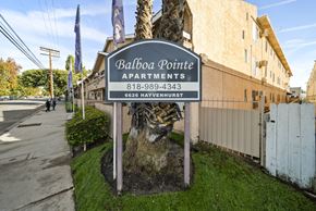 Van Nuys apartment for rent - A sign for Balboa Pointe Apartments is displayed in front of a building.