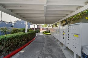 Buena Park apartment for rent - A long corridor with electrical boxes on the side.