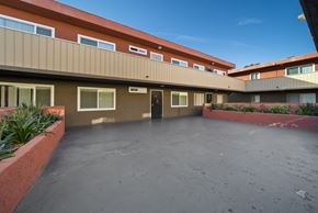North Hills apartment for rent - A courtyard with a building in the background.