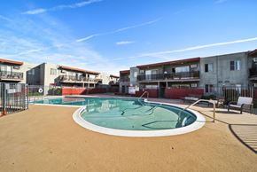 North Hills apartment for rent - A round above ground pool with a white border and a brown sandy area around it.