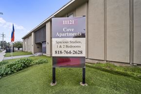 Sun Valley apartment for rent - A sign for Cove Apartments is displayed in front of a building.