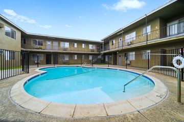 Sun Valley apartment for rent - A swimming pool in a courtyard surrounded by apartment buildings.