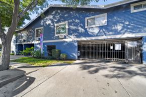 Van Nuys apartment for rent - A blue building with a sign that says "Monroe Pointe" on it.