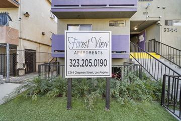 Los Angeles apartment for rent - A sign for Forest View Apartments is in front of a building.