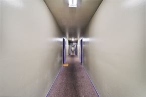 Los Angeles apartment for rent - A long hallway with a purple line on the floor.