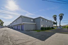 Fullerton apartment for rent - A building with a cracked road in front of it.