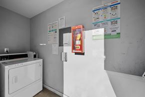 Los Angeles apartment for rent - A white washing machine sits in a laundry room with a white dryer.