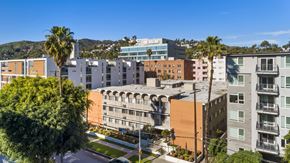 Hollywood apartment for rent - A view of a residential area with buildings and palm trees.