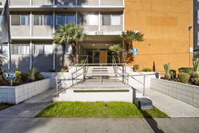 Hollywood apartment for rent - The image shows the front of a building with the number 6711 on it.