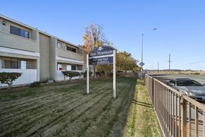 Palmdale apartment for rent - A sign for Iron Mountain Apartments stands in front of a building.
