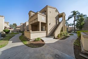 Rialto apartment for rent - A concrete staircase leads up to a building entrance.