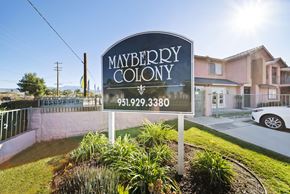 Hemet apartment for rent - A sign for Mayberry Colony with a phone number on it.