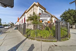 North Hills apartment for rent - A sign for North Hills Village with a phone number is displayed on a fence.