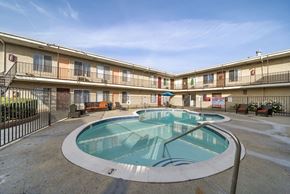 North Hills apartment for rent - A large outdoor pool in a courtyard surrounded by apartment buildings.
