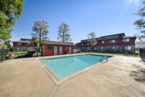 Lancaster apartment for rent - A swimming pool in front of a red building.
