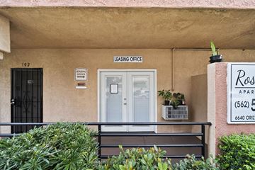 Long Beach apartment for rent - A building with a leasing office sign on the wall.