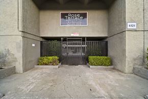 Whittier apartment for rent - A sign for Rose Terrace is on the wall above a gate.