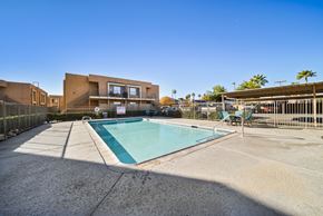 Perris apartment for rent - A swimming pool in front of a modern building.