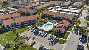Palmdale apartment for rent - A residential area with houses and a swimming pool.
