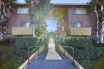 Pacoima apartment for rent - A sunny day at the entrance of a residential building.
