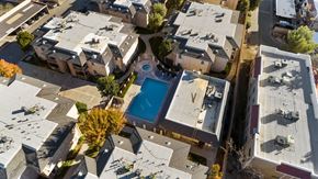 Palmdale apartment for rent - A bird's eye view of a residential area with a swimming pool.