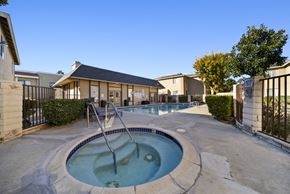 Palmdale apartment for rent - A hot tub sits in the middle of a patio.