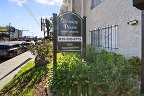 Van Nuys apartment for rent - A sign for Sherman Pointe Apartments is in front of a building.