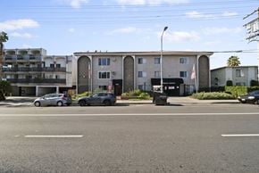Van Nuys apartment for rent - A street view of a residential area with cars parked on the side of the road.