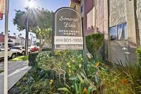 Van Nuys apartment for rent - A sign for Somerset Place Apartment Homes is in front of a building.