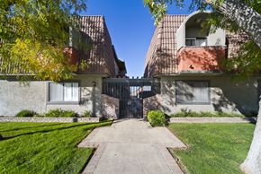 Lancaster apartment for rent - A building with a gate in the middle of a pathway.