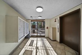 Los Angeles apartment for rent - A hallway with a tiled floor and a door on the right.
