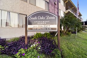 Van Nuys apartment for rent - A sign for South Oaks Pointe Apartments stands in front of a building.