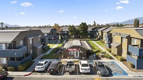 Rialto apartment for rent - A sunny day in a residential area with cars parked in a row.
