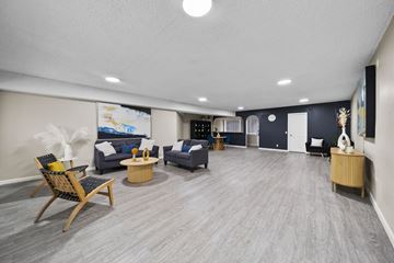 North Hollywood apartment for rent - A spacious living room with a grey carpet and wooden flooring.