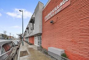 North Hollywood apartment for rent - A red brick building with the words "Studio Village" on it.