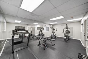 North Hollywood apartment for rent - A spacious gym with treadmills, elliptical machines, and other exercise equipment.