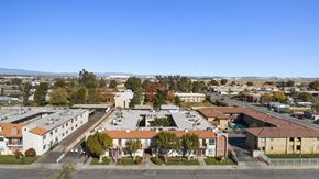 Palmdale apartment for rent - A view of a residential area with houses and trees.