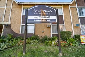 Van Nuys apartment for rent - A sign for Terrace Pointe Apartments stands in front of a building.