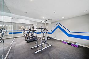 Long Beach apartment for rent - A gym with a blue stripe on the wall.