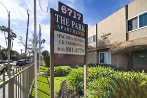 Reseda apartment for rent - A sign for 6717 The Park Apartments is displayed in front of a building.