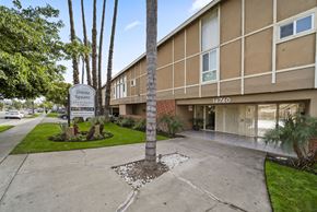 Panorama City apartment for rent - A building with a sign that says "Torrance Square" in front of it.