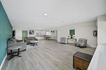 North Hollywood apartment for rent - A living room with a grey sofa and a wooden coffee table.