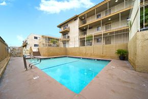 North Hollywood apartment for rent - A swimming pool in front of a building.