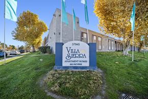 Palmdale apartment for rent - Villa Sterpa apartment complex with a sign in front.