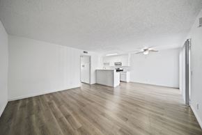 San Bernardino apartment for rent - A room with wooden flooring and a ceiling fan.
