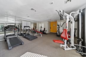 Lancaster apartment for rent - A gym with treadmills, weight machines, and benches.